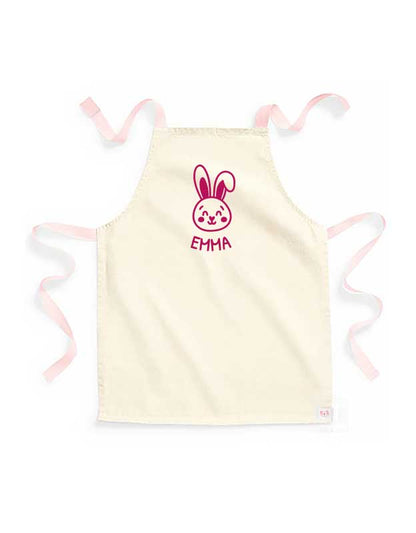 personalisierte Kinderschuerze mit Namen - beige Kinderschuerze mit peach & Aufdruck pink