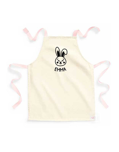 personalisierte Kinderschuerze mit Namen - beige Kinderschuerze mit Peach & Aufdruck Schwarz